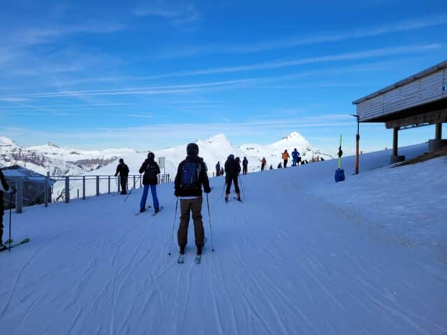 Children enjoying the snow outside Chalet Bergheim at ISZL’s Outdoor Centre in Switzerland.
