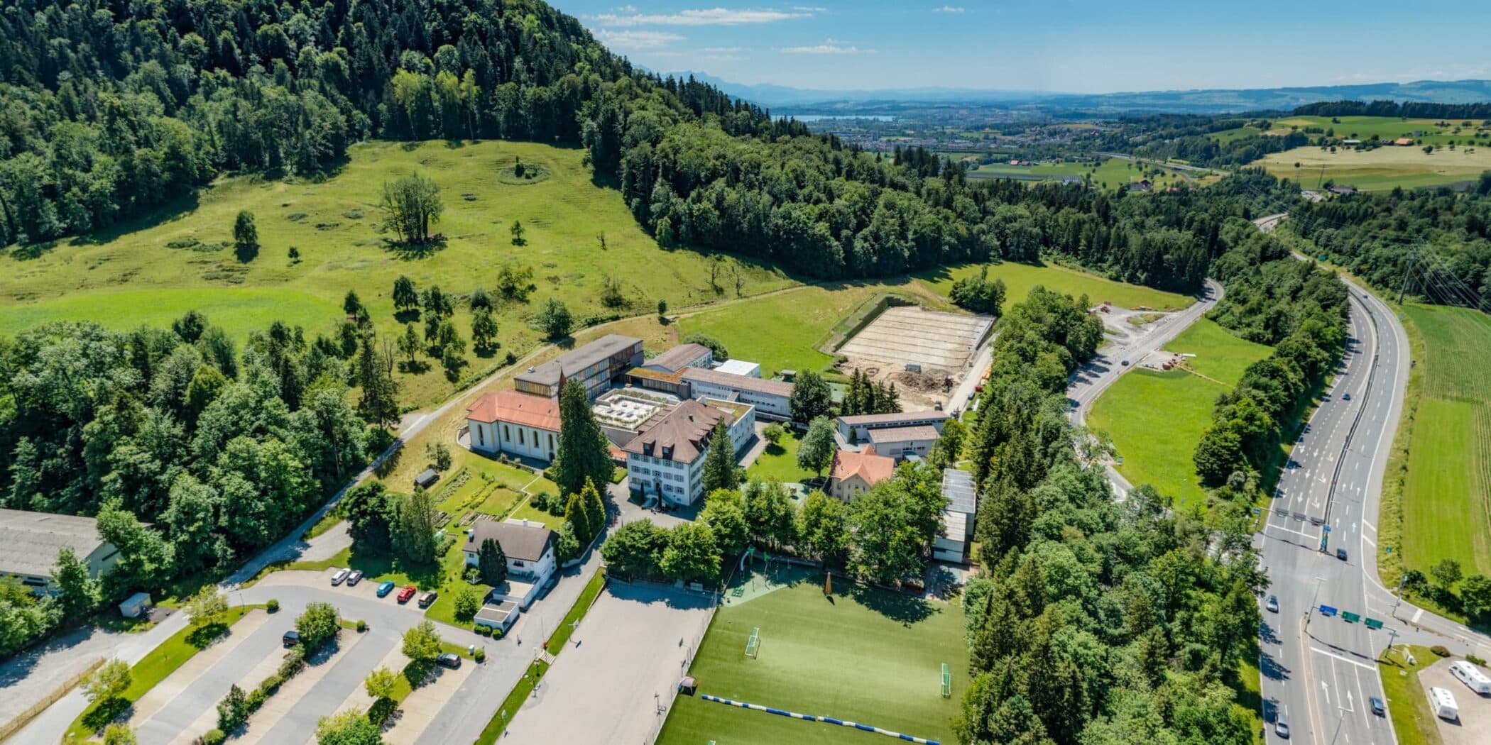 Aerial view of ISZL’s Zug Campus in Baar, showcasing the welcoming environment of our International English School in Switzerland.