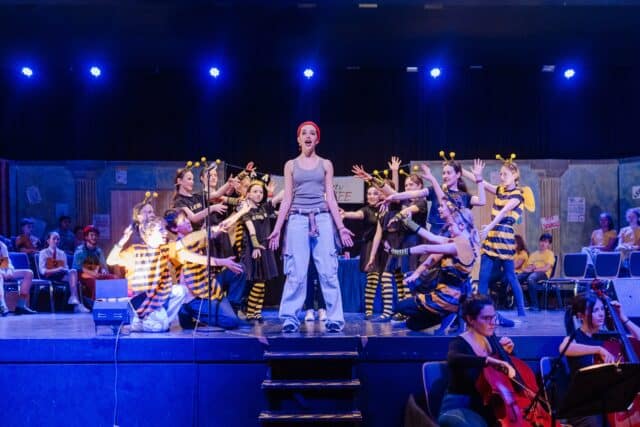 Students performing in a drama production, reflecting ISZL’s commitment to creativity, expression, and holistic education as part of its mission and vision.