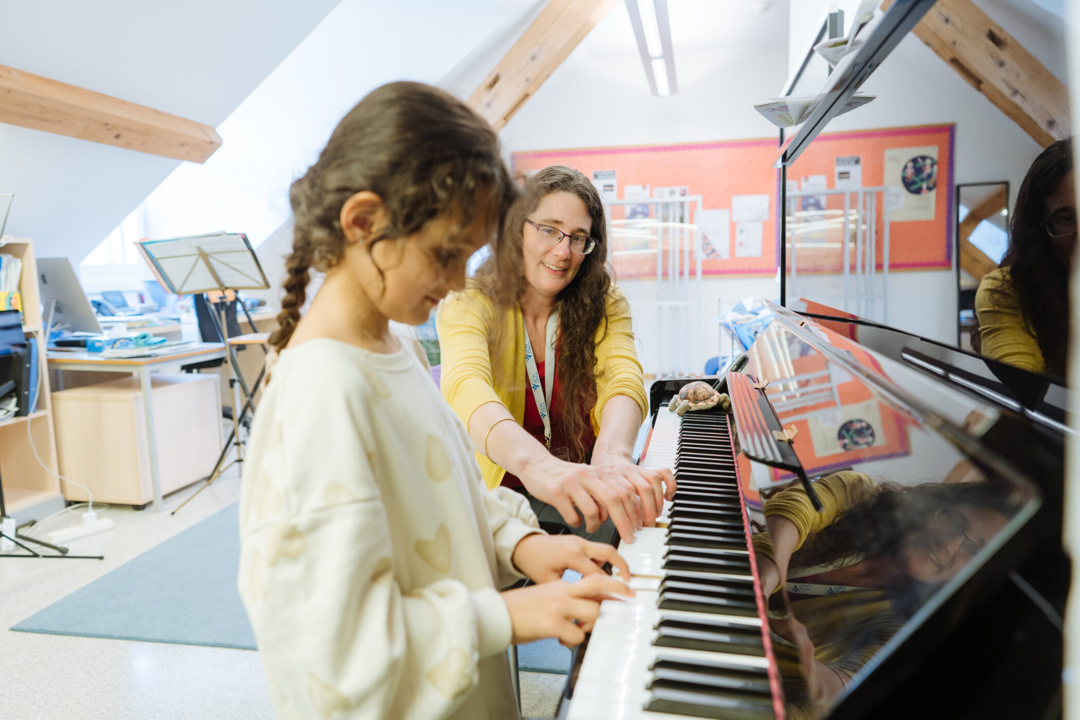 young student playing piano