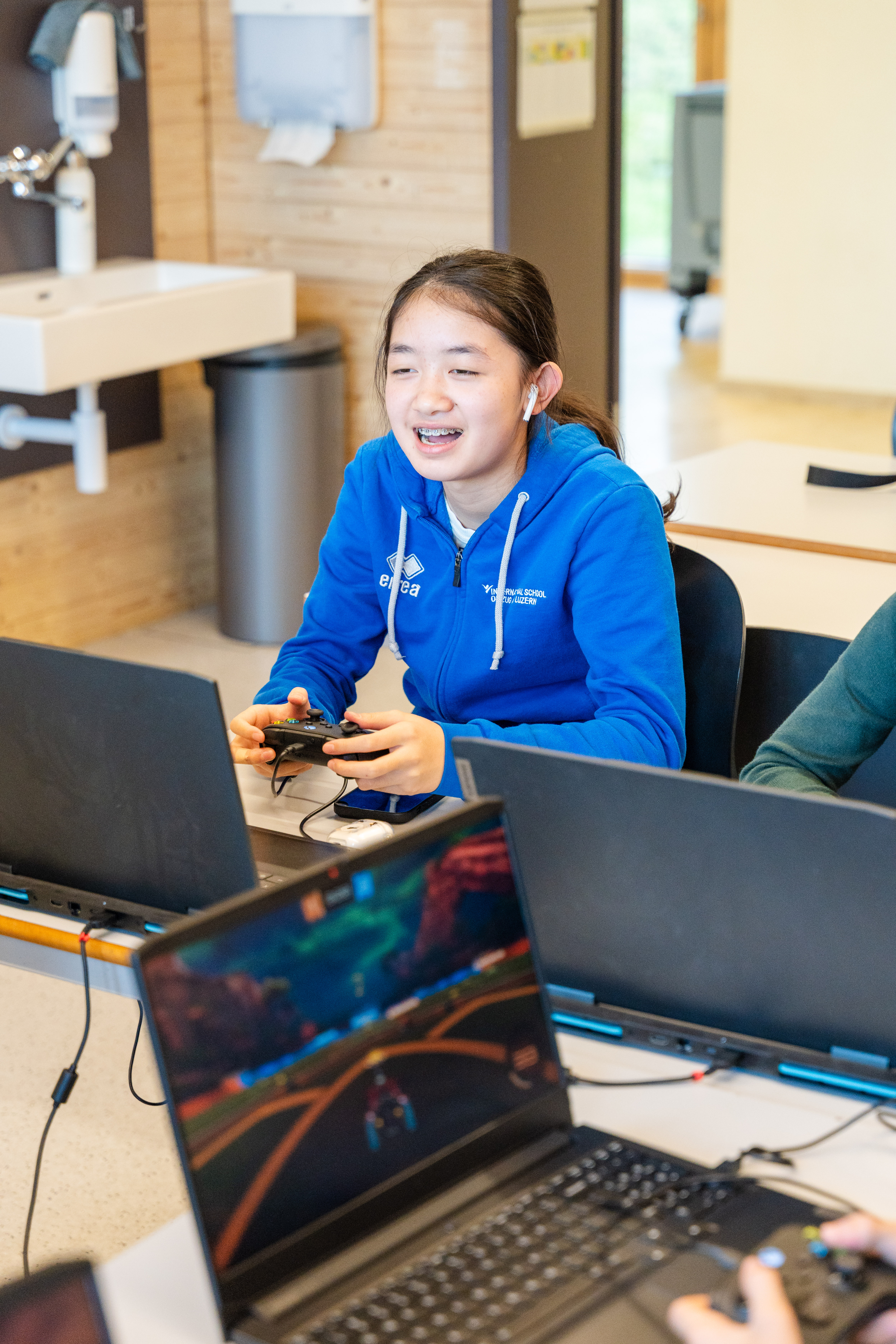 students with laptop