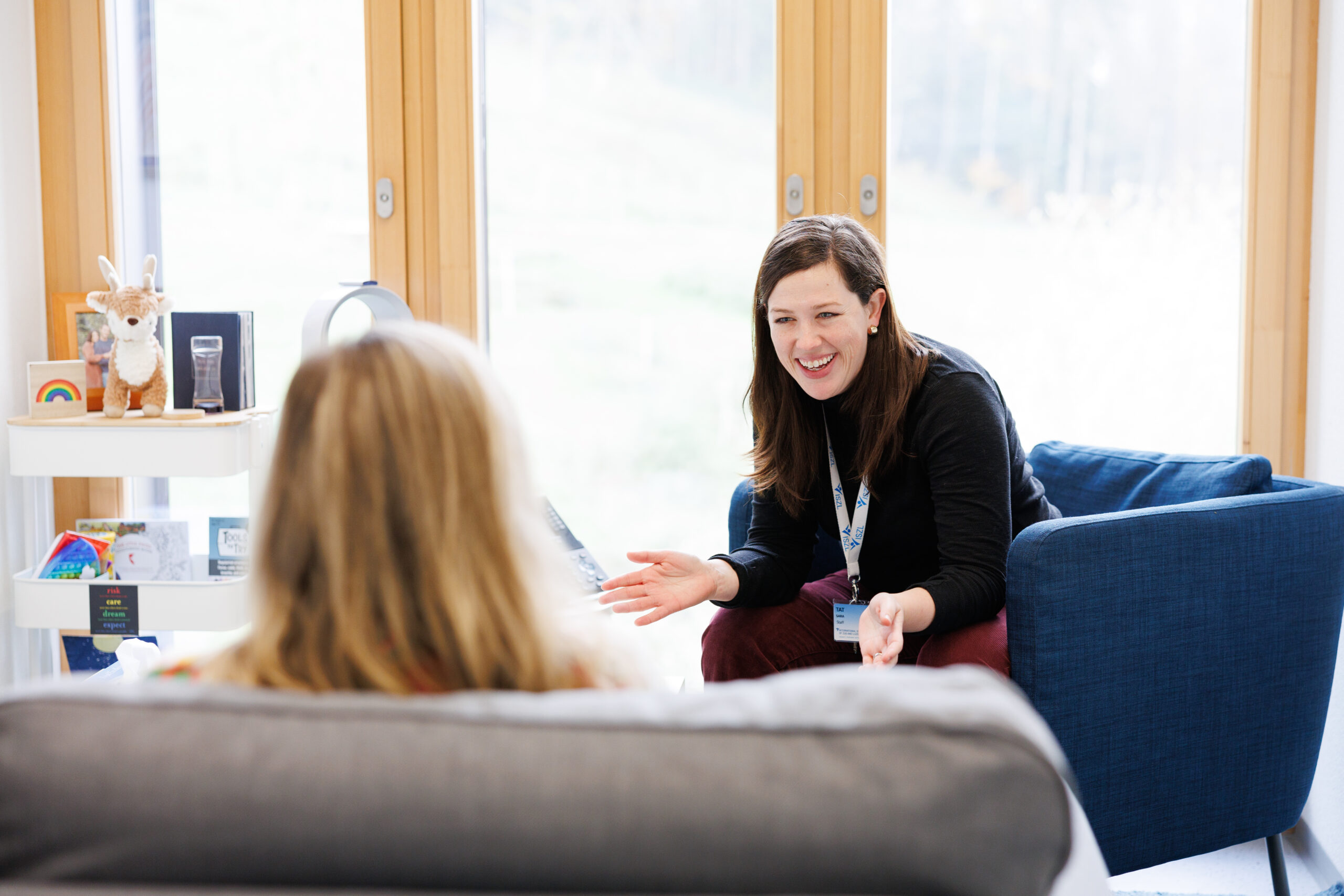 middle school student discussing with support staff