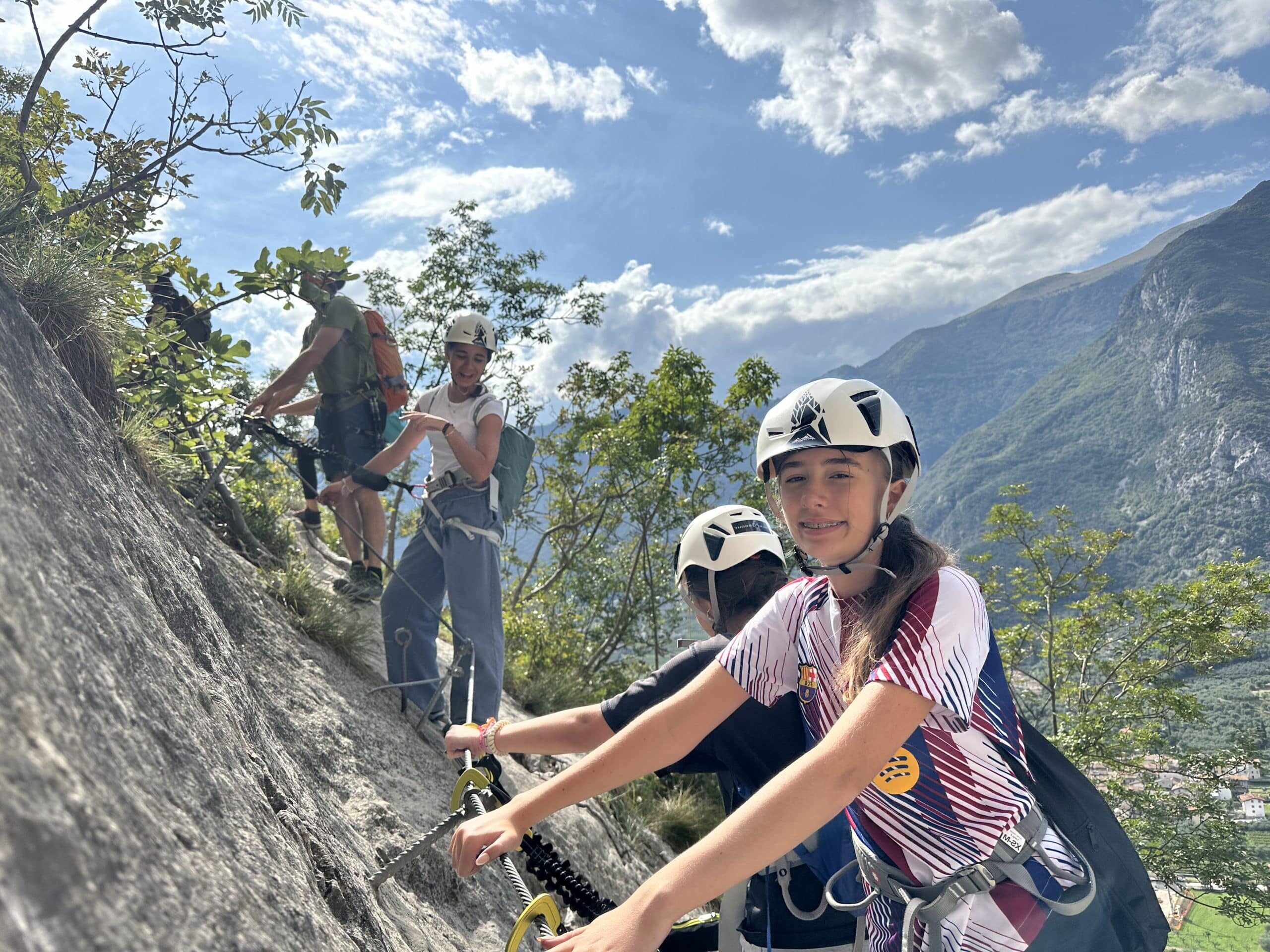 student rock climbing