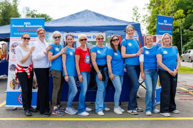 ISZL Parents’ Association team gathered at an event, celebrating community and volunteer spirit.