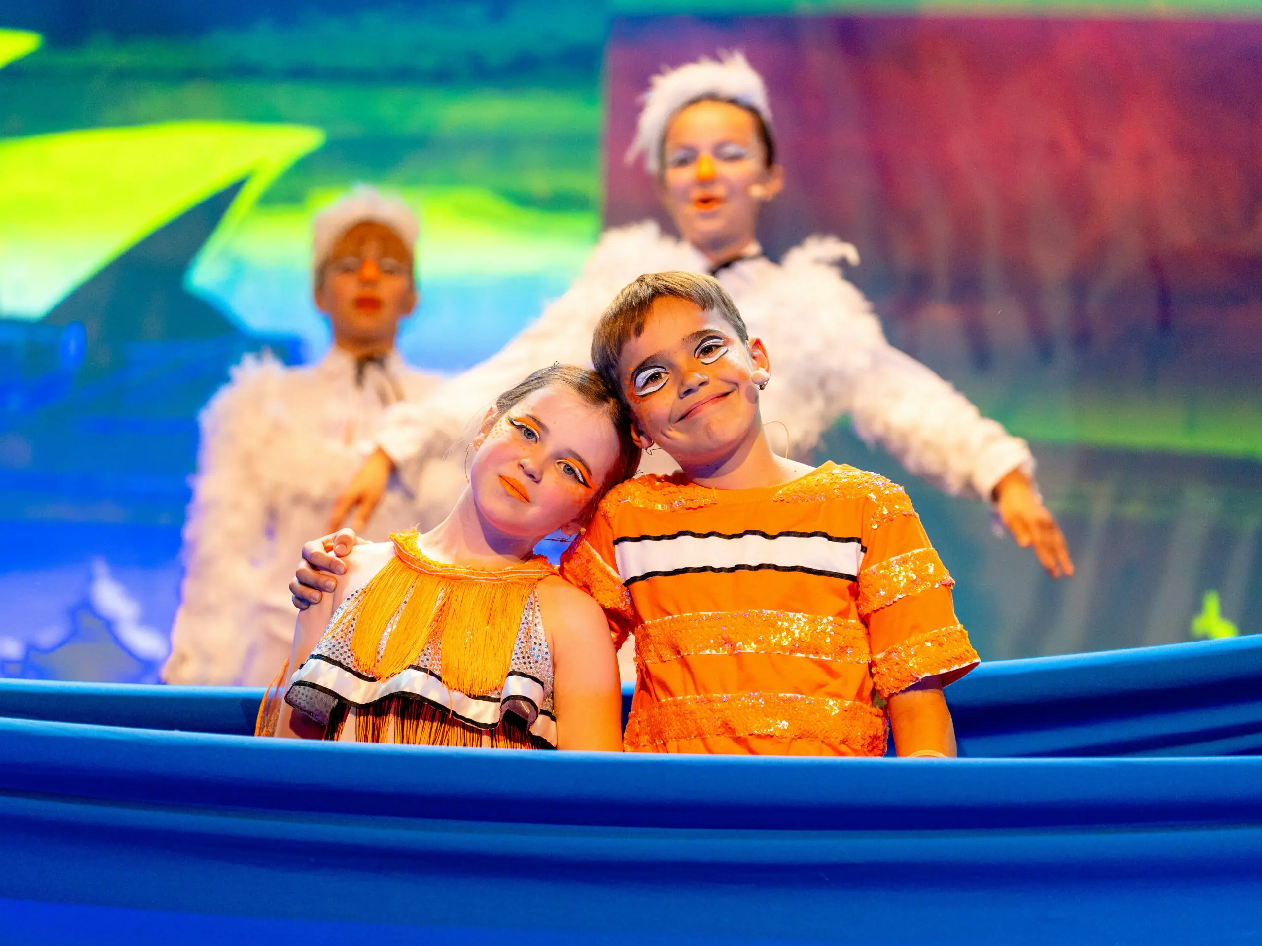 Primary School students on stage performing in Finding Nemo, showcasing creativity and teamwork.