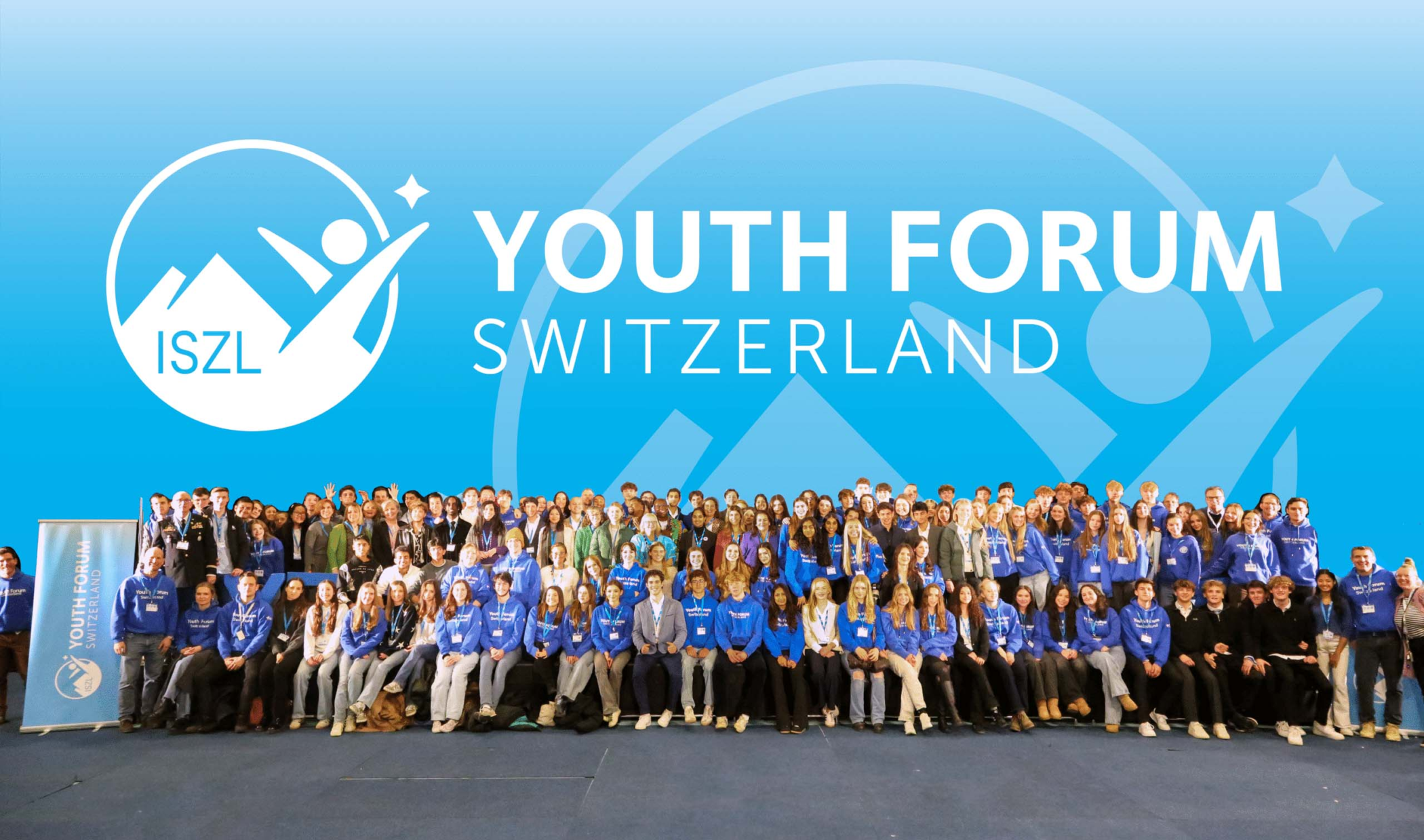 A large group of students collaborating and actively participating together at the Youth Forum Switzerland 2025 event at ISZL.