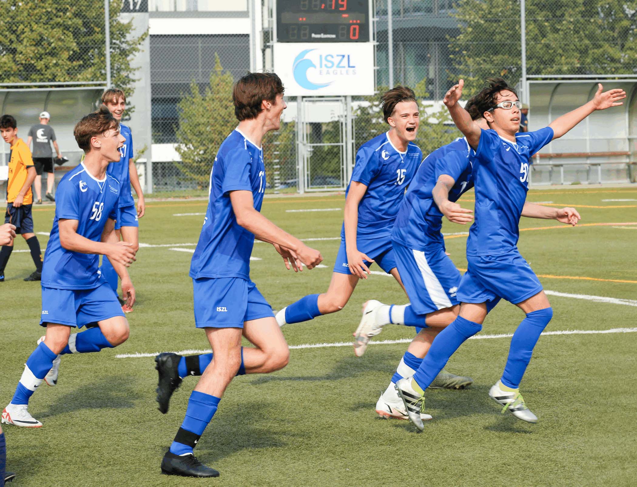 ISZL Middle School football team celebrating