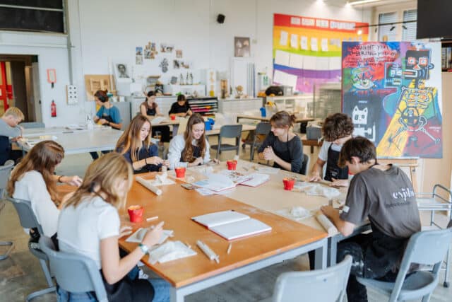 ISZL students creating artwork during an art class.