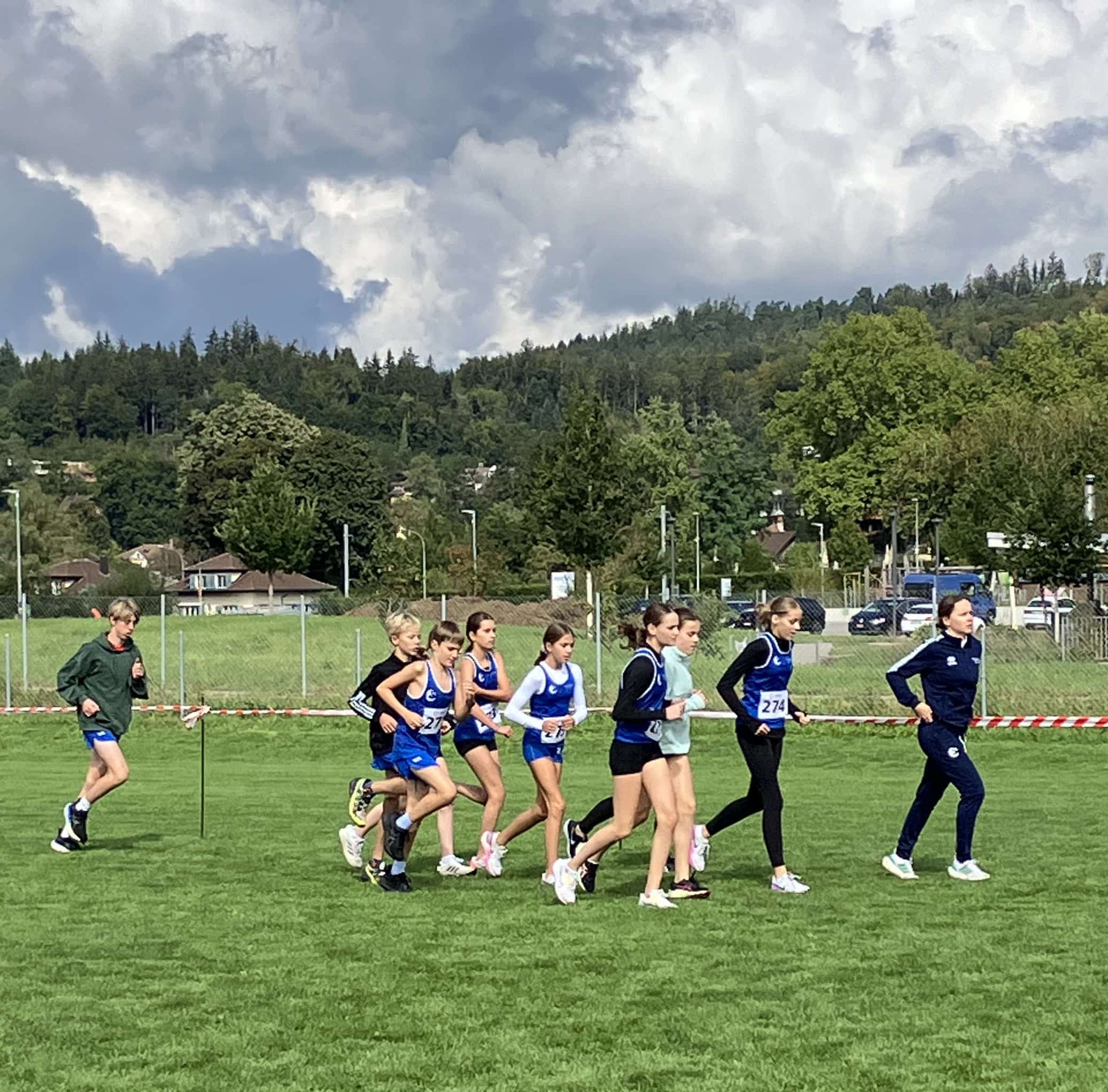 ISZL Students training outdoors for cross-country running.