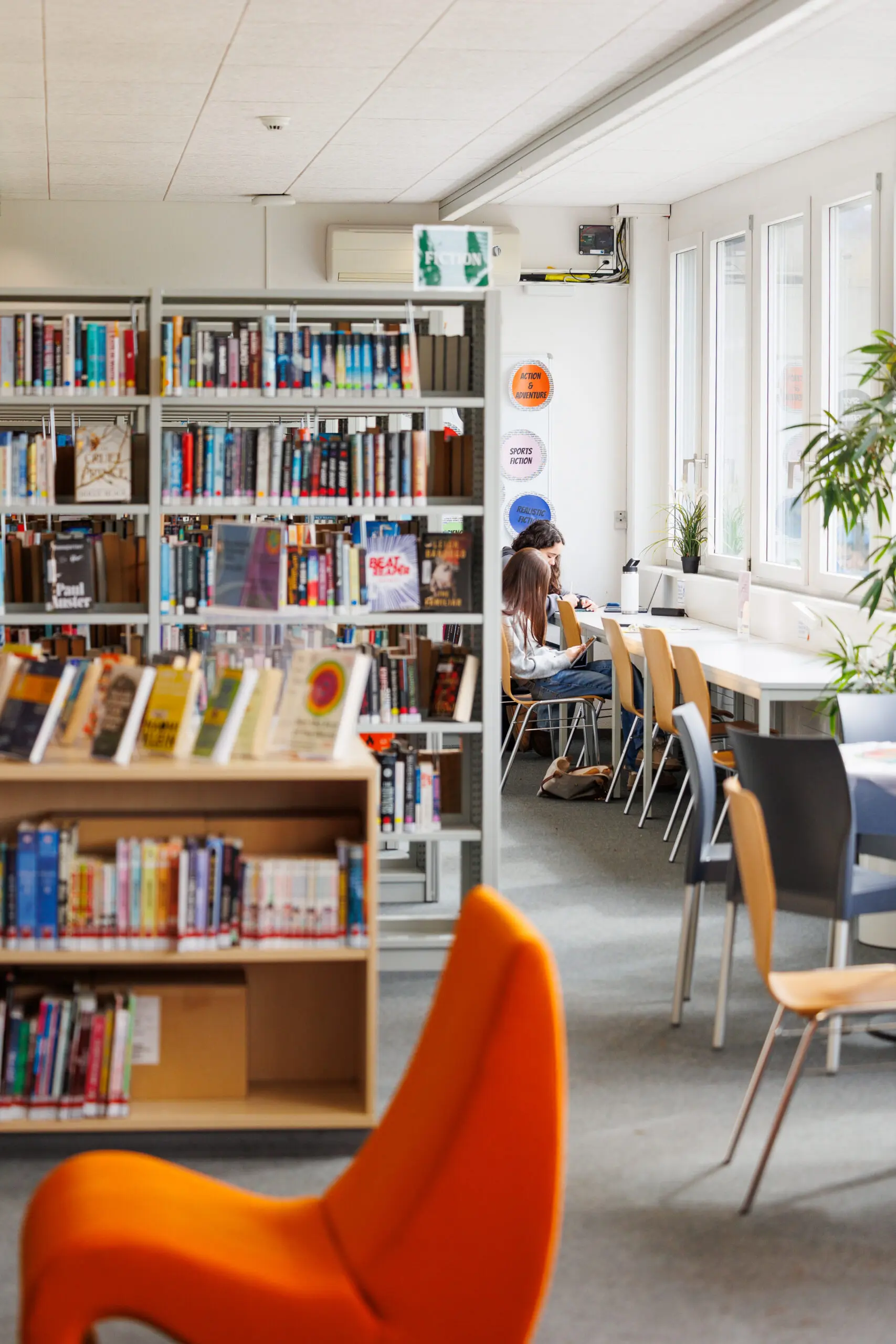 Two high school students studying in the ISZL library.