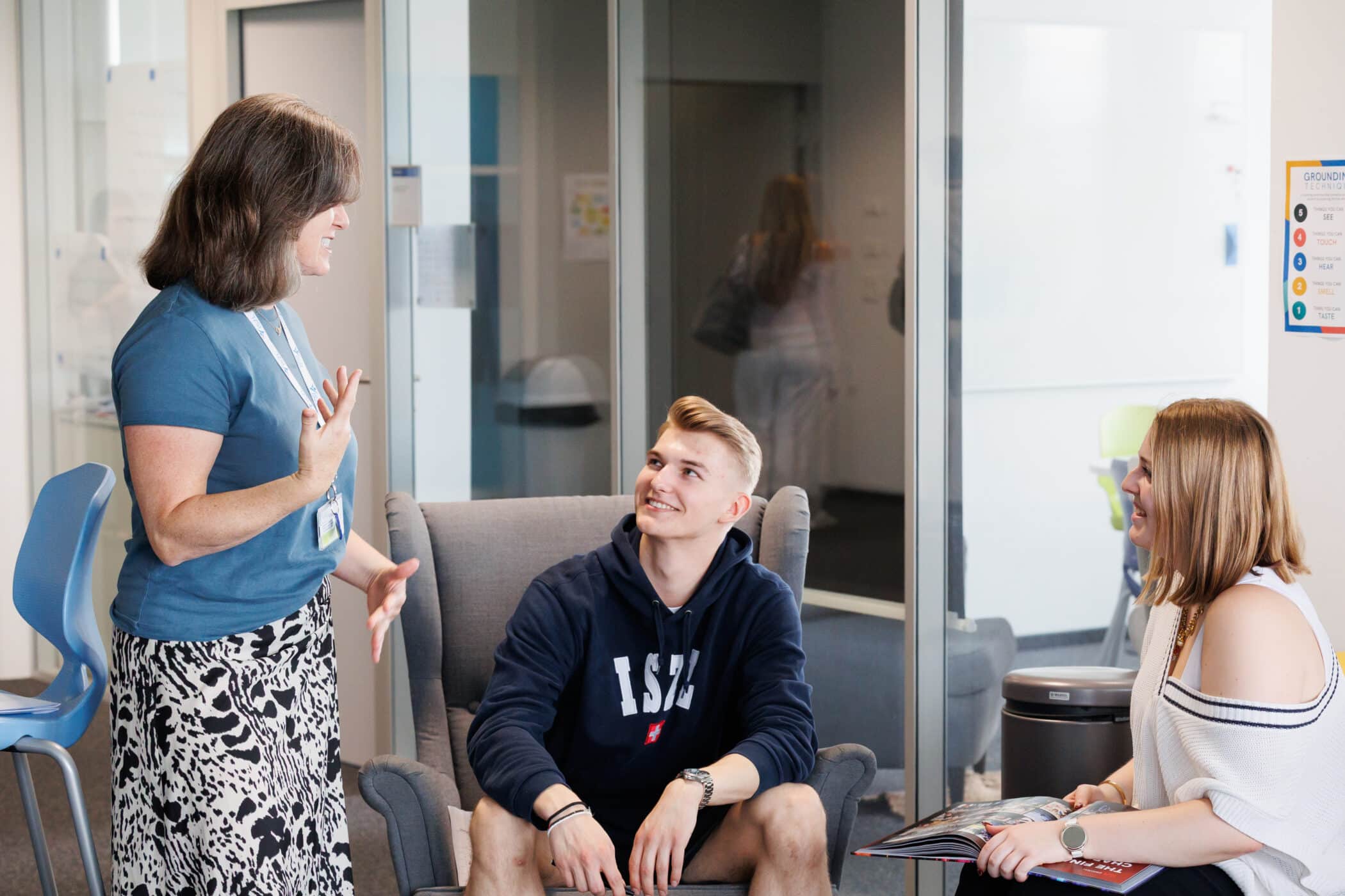 counsellor and high school students chatting