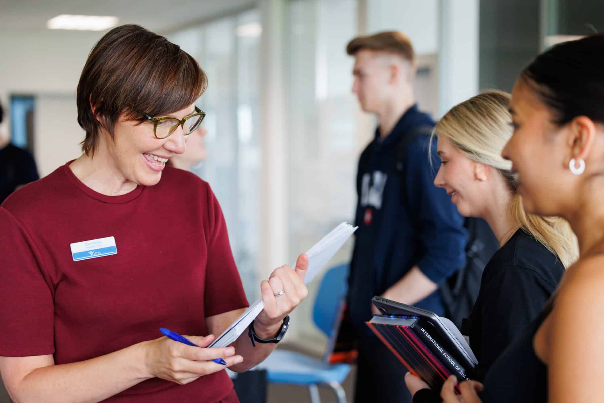 University advisor helping high school students