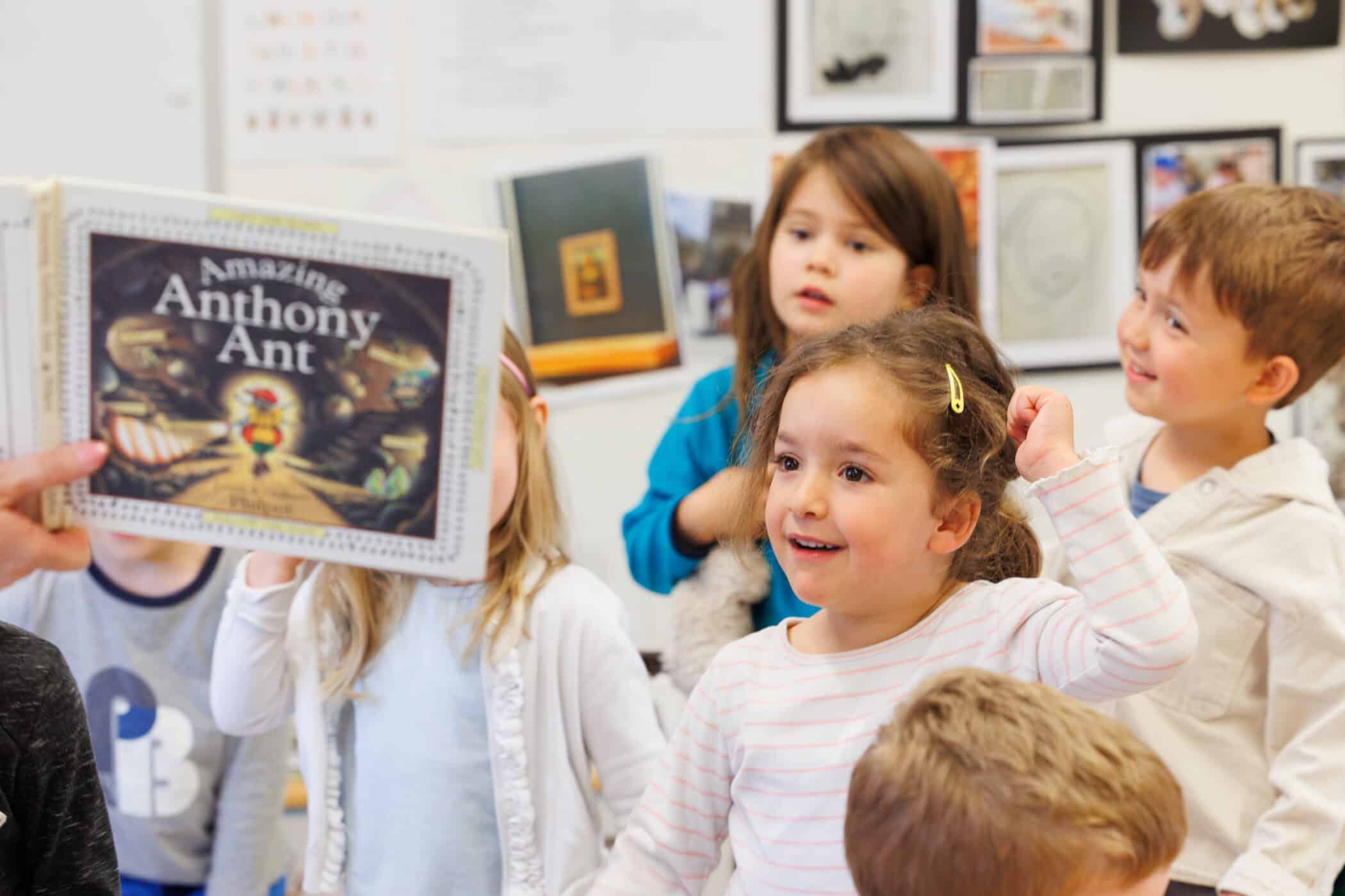 young students learning with books