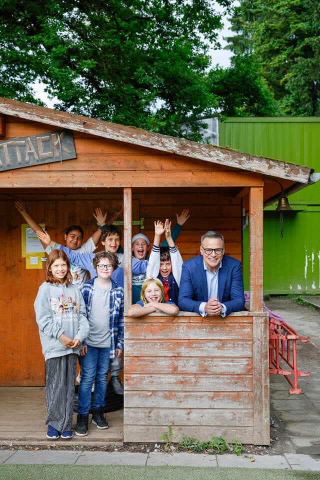 students and director in the snack attack stand
