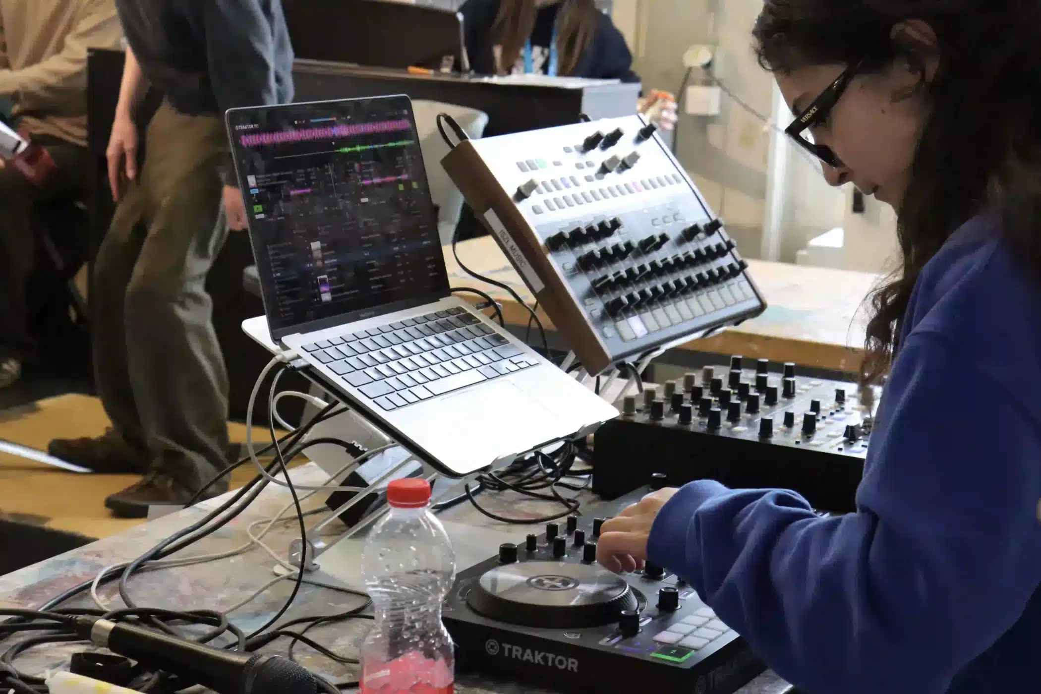 ISZL student managing the sound system during the Youth Forum Switzerland 2026.