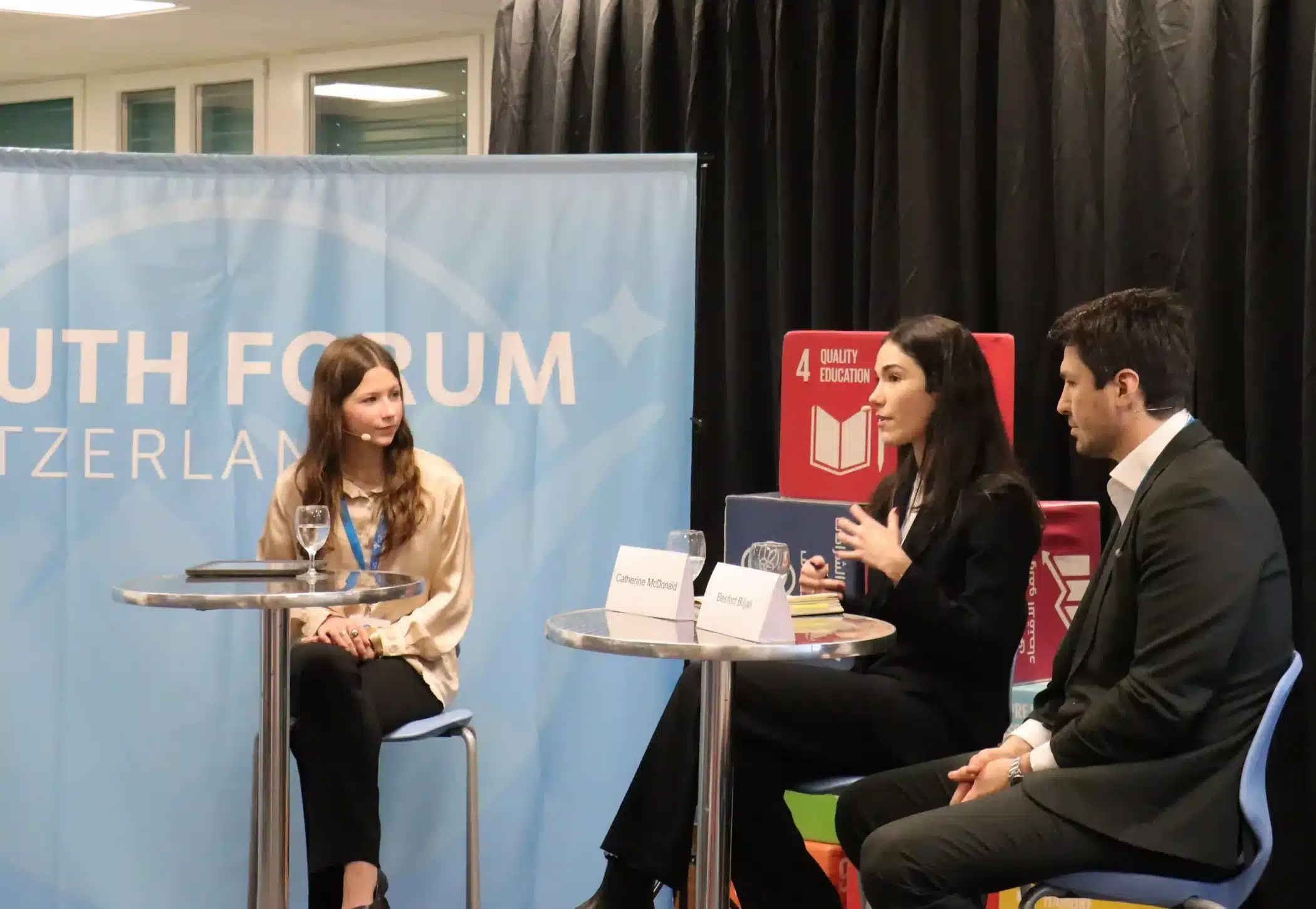 ISZL student interviewing two speakers at the Youth Forum Switzerland 2026.