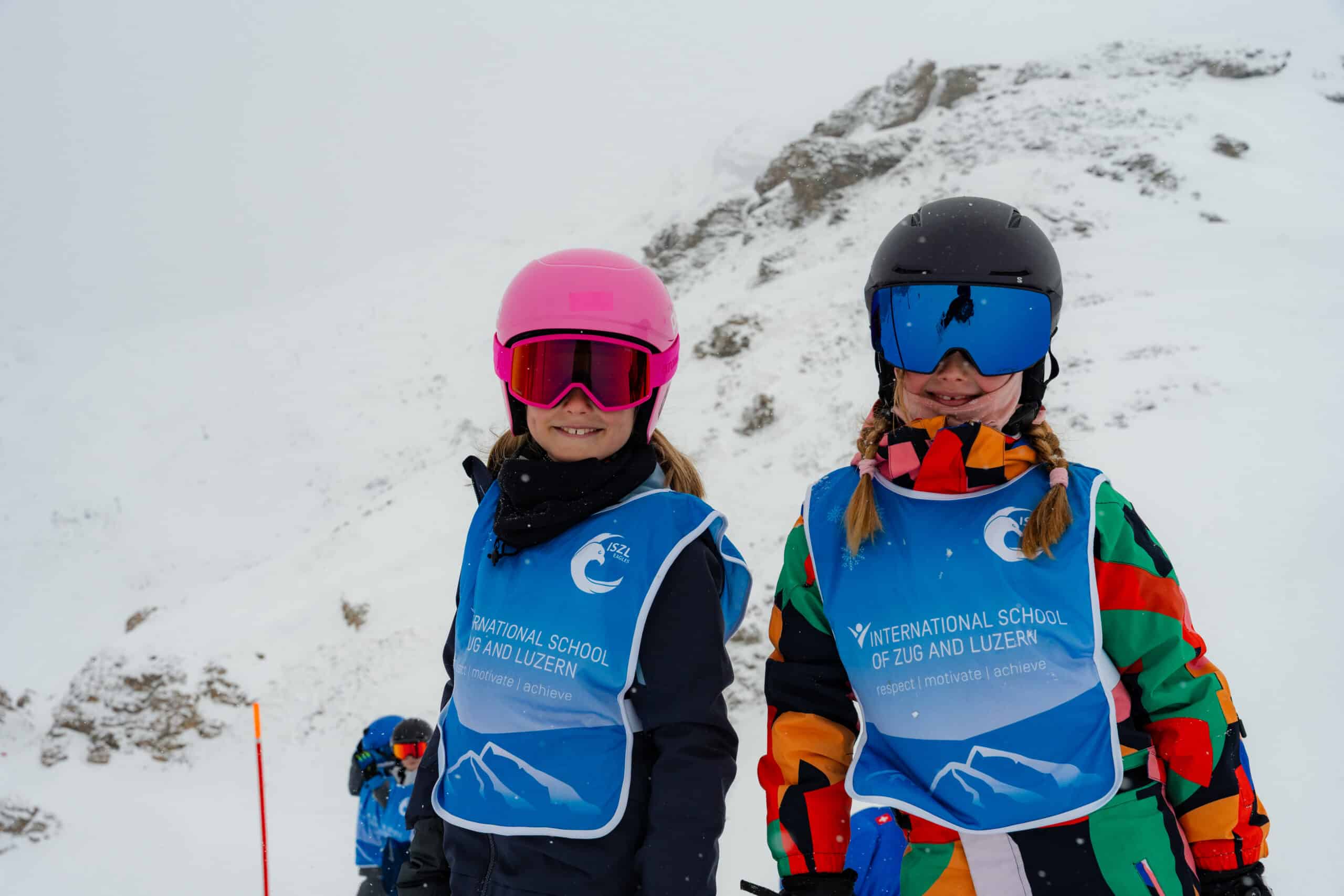 students in the snow in ski gear