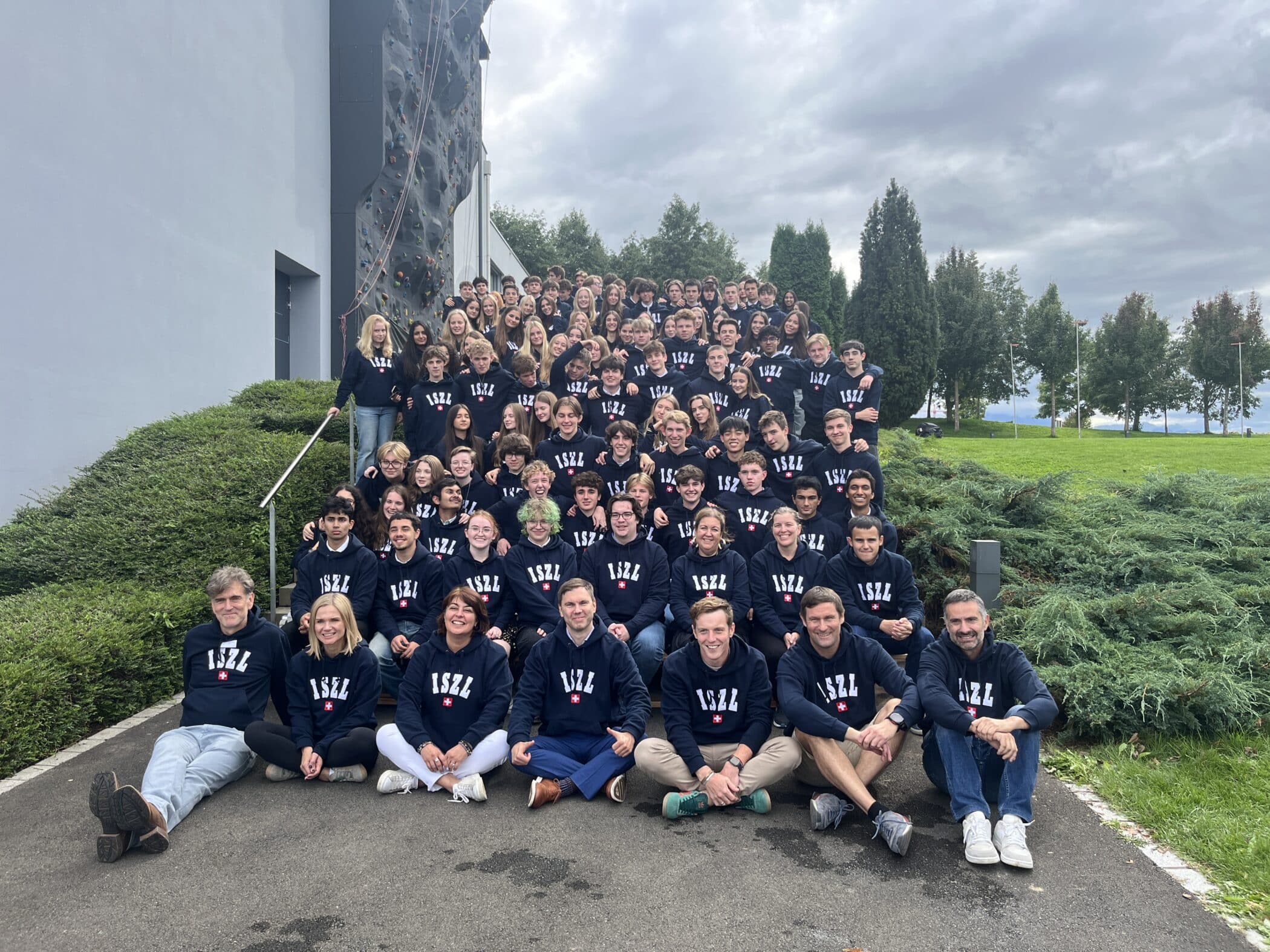 Students on steps in ISZL hoodies
