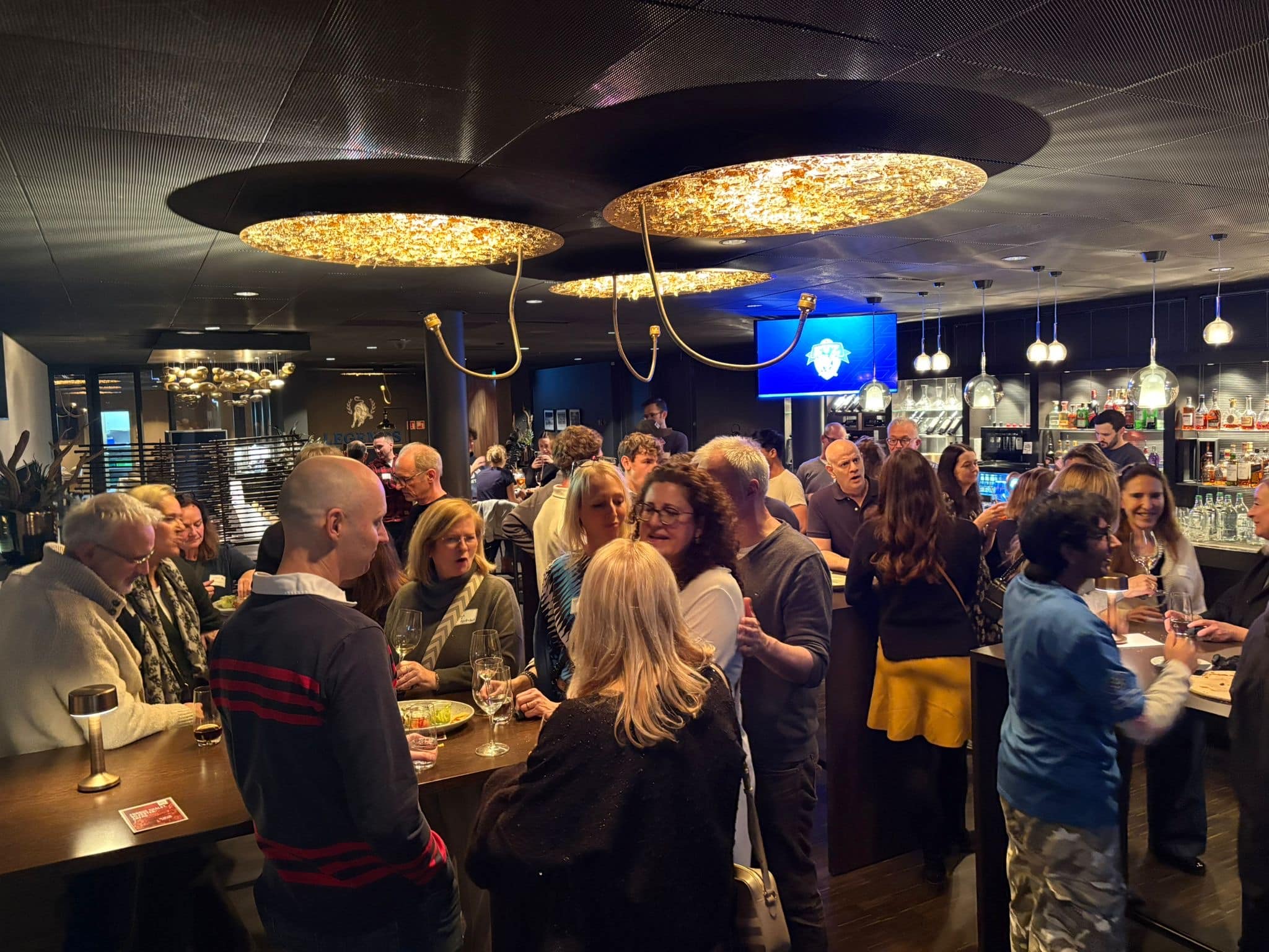 Alumni students gathering at winter reunion in a bar