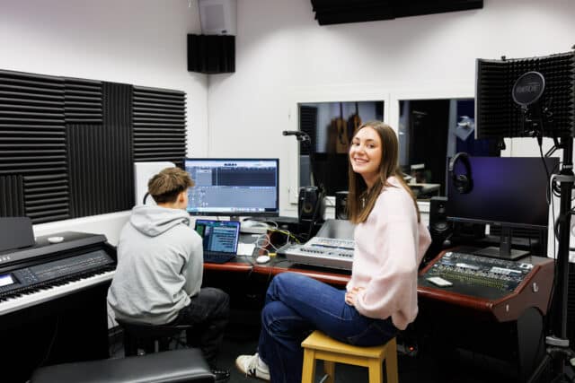high school students in the iszl media recording studio
