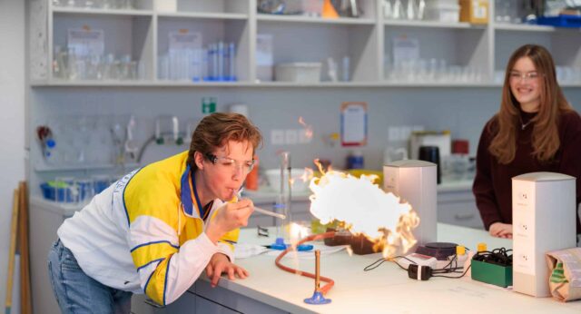 high school students in chemistry lab
