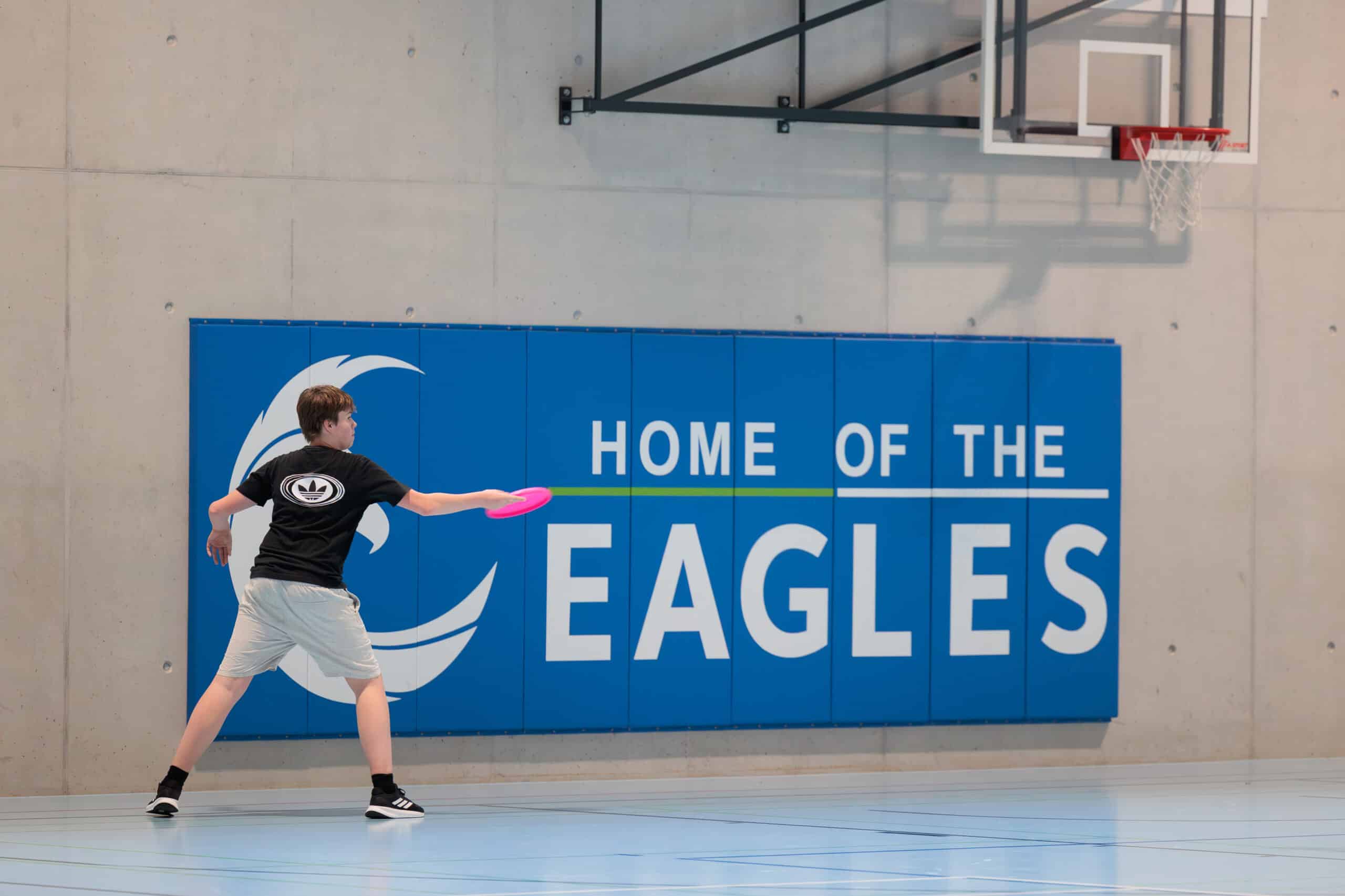 high school student in ISZL gym