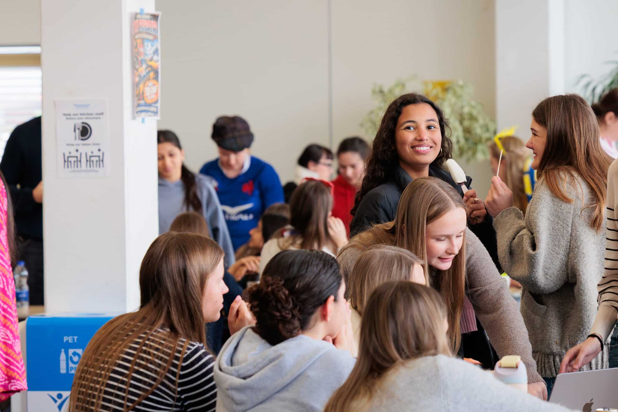 high school student smiling in the lunchroom