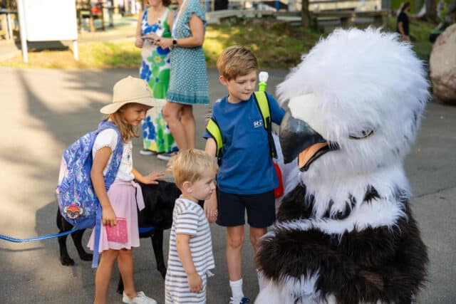 english speaking students at zug campus with mascot Eddie