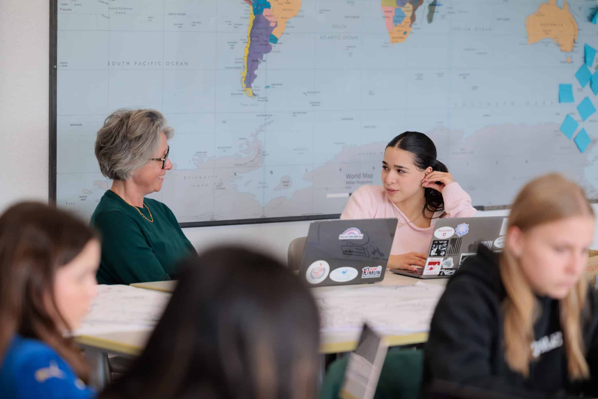 staff teaching high school students