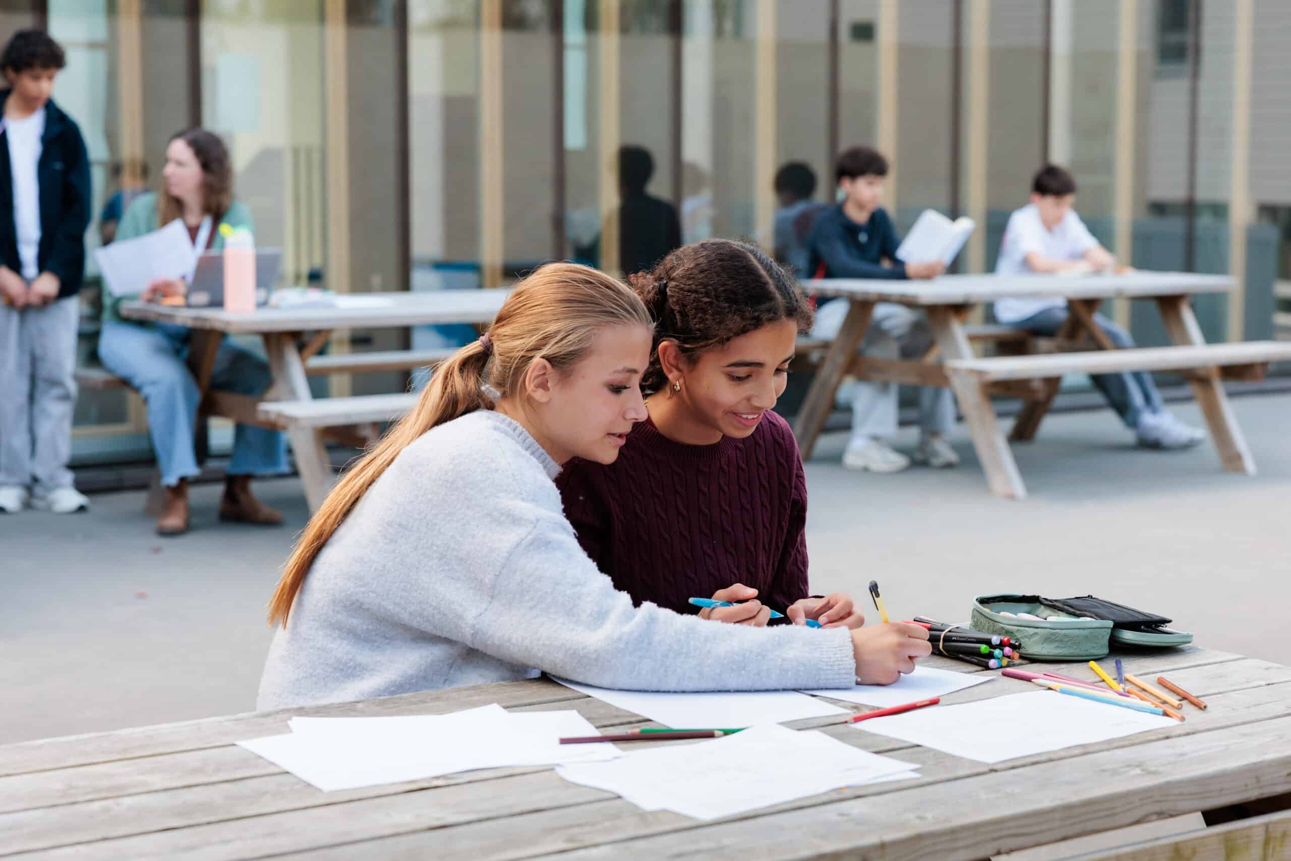 middle school students writing together