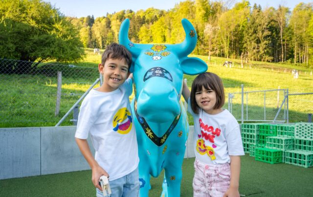 the ISZL cow mascot and family