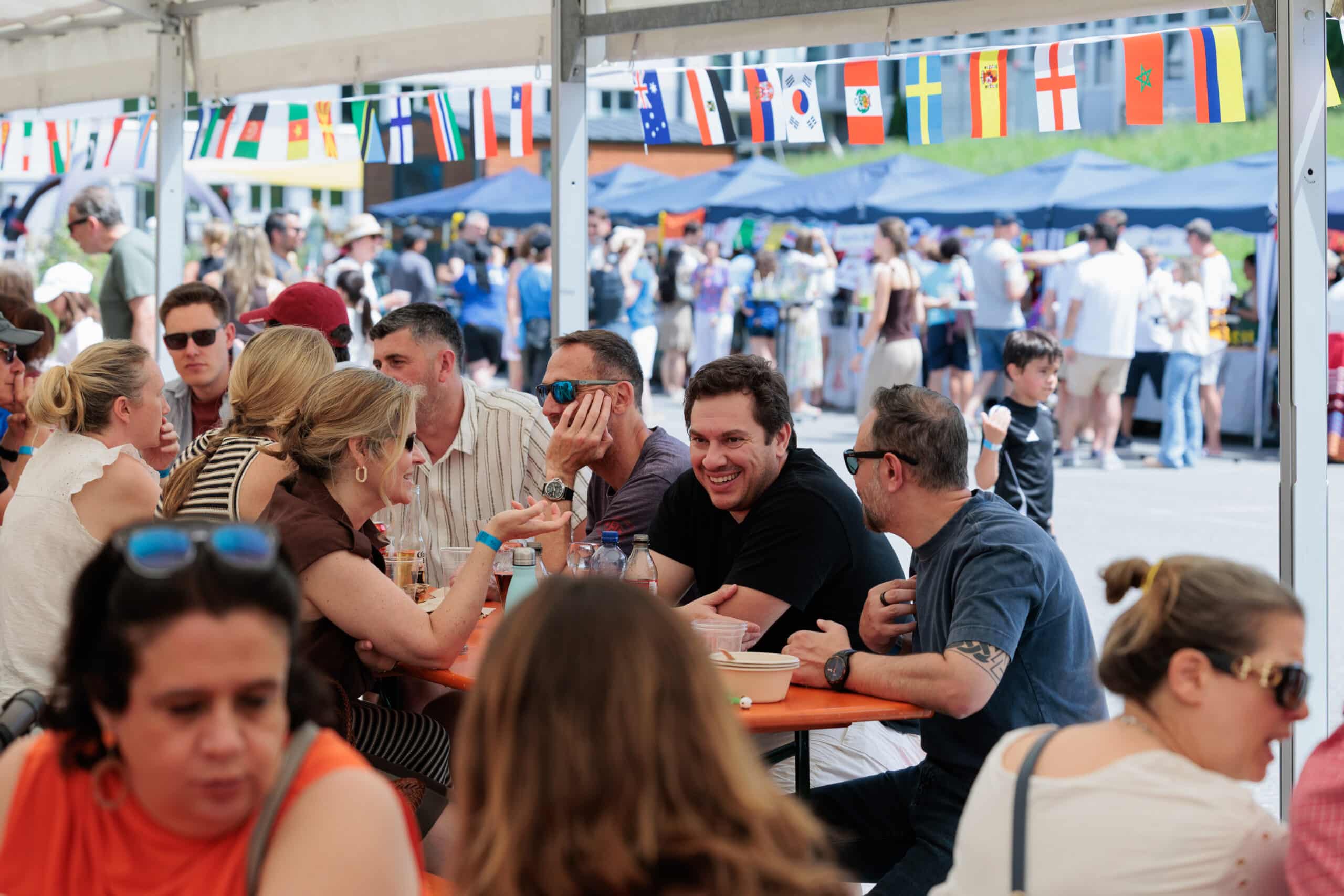iszl community have fun together in a marquee